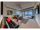Modern bedroom featuring a sliding glass door, sleek furniture, and city views at 677 Overlook Rim Dr, Henderson, NV 89012