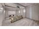 A modern home theater features tiered seating, projector, and wall sconces at 677 Overlook Rim Dr, Henderson, NV 89012