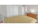 Bedroom with closet and wooden dresser with four drawers at 7177 W Camero Ave, Las Vegas, NV 89113