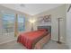 Inviting bedroom with bright light from a window, soft carpet, and decor at 7177 W Camero Ave, Las Vegas, NV 89113