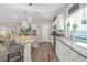 Eat-in kitchen featuring granite countertops, a breakfast bar, and stainless steel appliances at 7177 W Camero Ave, Las Vegas, NV 89113
