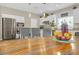 Modern kitchen with stainless steel appliances, white cabinetry, and a cozy breakfast bar, ideal for casual dining at 7177 W Camero Ave, Las Vegas, NV 89113