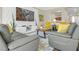 Open-concept living room featuring sleek furnishings, and modern decor with a decorative wall at 7177 W Camero Ave, Las Vegas, NV 89113