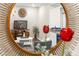 Stylish living room reflecting in a decorative mirror, showcasing modern design and a comfortable seating area at 7177 W Camero Ave, Las Vegas, NV 89113