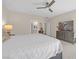 Spacious bedroom with neutral tones, a ceiling fan, and a large dresser, providing ample storage and comfort at 7177 W Camero Ave, Las Vegas, NV 89113