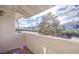 Outdoor balcony area with neighborhood views, trees and blue sky at 7300 Pirates Cove Rd # 2093, Las Vegas, NV 89145