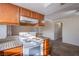 View of kitchen and living room featuring modern appliances and ample cabinet space with bar top eating area at 7300 Pirates Cove Rd # 2093, Las Vegas, NV 89145