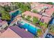 Aerial view of community pool with hot tub, tennis courts and nearby landscaping at 7300 Pirates Cove Rd # 2093, Las Vegas, NV 89145