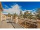 Wide view from a large balcony showing landscape with mature trees and distant mountain views at 7466 Matilda St, Las Vegas, NV 89113