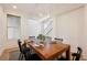 Elegant dining room with a modern chandelier, wainscoting, and seating for six at 7466 Matilda St, Las Vegas, NV 89113