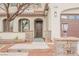 Inviting home with a well-maintained yard, stone accents, and covered entrance at 7466 Matilda St, Las Vegas, NV 89113