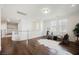 Spacious loft area with wood floors, natural light, and decorative railing at 7466 Matilda St, Las Vegas, NV 89113