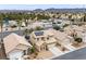 Aerial view of a neighborhood featuring a two-story home with solar panels and desert landscaping at 7652 Borealis St, Las Vegas, NV 89123