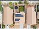 Bird's-eye view of home's roof with solar panels, backyard with trampoline, green lawn, and desert landscaping at 7652 Borealis St, Las Vegas, NV 89123