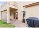 Charming backyard patio with brick pavers, lush lawn, covered area, and outdoor seating at 7652 Borealis St, Las Vegas, NV 89123