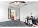 Bedroom with a view of an ensuite bathroom, hardwood floors, and ceiling fan at 7652 Borealis St, Las Vegas, NV 89123