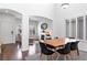 Bright dining room with modern table, adjacent to a living room with a fireplace at 7652 Borealis St, Las Vegas, NV 89123