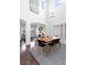 Open dining room with high ceilings, a modern table and chairs, and natural light at 7652 Borealis St, Las Vegas, NV 89123