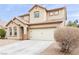 Classic two-story home with a two-car garage and desert landscaping at 7652 Borealis St, Las Vegas, NV 89123