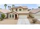 Inviting two-story home with a two-car garage, desert landscaping, and modern solar panels at 7652 Borealis St, Las Vegas, NV 89123