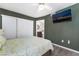 Bedroom features a ceiling fan, closet with sliding doors, and an ensuite bathroom at 7950 W Flamingo Rd # 1037, Las Vegas, NV 89147