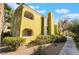 Condo exterior showcases balconies and well-maintained landscaping and private entrances at 7950 W Flamingo Rd # 1037, Las Vegas, NV 89147