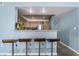 Kitchen bar features seating for four and a pass-through window into the main kitchen area at 7950 W Flamingo Rd # 1037, Las Vegas, NV 89147
