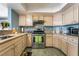 Bright kitchen features stainless steel appliances, tile backsplash, hard surface countertops and wood cabinets at 7950 W Flamingo Rd # 1037, Las Vegas, NV 89147