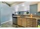Kitchen sink area features stainless steel appliances and a view into the living room at 7950 W Flamingo Rd # 1037, Las Vegas, NV 89147