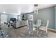 Open-concept living area with bar and dining area, plenty of seating and neutral color scheme at 7950 W Flamingo Rd # 1037, Las Vegas, NV 89147