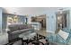 Open-concept floor plan shows living room, kitchen with breakfast bar, and dining area at 7950 W Flamingo Rd # 1037, Las Vegas, NV 89147