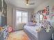 Comfortable bedroom with a ceiling fan, cozy daybed, and colorful decor at 817 Peachy Canyon Cir # 204, Las Vegas, NV 89144