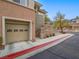 Exterior view highlighting the garage and accessible walkways of the property at 817 Peachy Canyon Cir # 204, Las Vegas, NV 89144