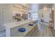 Bright kitchen with quartz countertops, stainless steel appliances, and seating at the island at 817 Peachy Canyon Cir # 204, Las Vegas, NV 89144