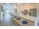 Bright open kitchen features a spacious island, modern appliances, and stylish blue seating at 817 Peachy Canyon Cir # 204, Las Vegas, NV 89144