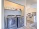 Convenient laundry area with modern appliances and plenty of storage space, adjacent to the kitchen at 817 Peachy Canyon Cir # 204, Las Vegas, NV 89144
