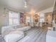 Open-concept living area with modern furniture, a dining space, and access to a balcony at 817 Peachy Canyon Cir # 204, Las Vegas, NV 89144