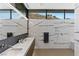Bright bathroom features marble walls, a double sink vanity, and a rainfall shower system at 9 Boulderback Dr, Henderson, NV 89012