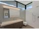 A modern bathroom featuring a walk-in shower, a large mirror, and a sleek vanity with a clean design at 9 Boulderback Dr, Henderson, NV 89012