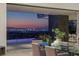 Contemporary dining area with stunning city view and stylish decor at 9 Boulderback Dr, Henderson, NV 89012