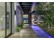 Stunning modern entryway featuring a water feature and city views beyond the open floor plan at 9 Boulderback Dr, Henderson, NV 89012