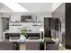 Modern kitchen with marble backsplash, stainless steel appliances, and a large kitchen island at 9 Boulderback Dr, Henderson, NV 89012