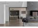 Open-concept design with fireplace, tile wall, and access to the kitchen at 9 Boulderback Dr, Henderson, NV 89012