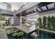 Contemporary living room features a water feature, gray accents, and expansive mountain views at 9 Boulderback Dr, Henderson, NV 89012