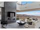Beautiful living room featuring a fireplace, city views, and sleek modern design at 9 Boulderback Dr, Henderson, NV 89012