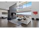 Contemporary living room with a fireplace, city views, and lots of space at 9 Boulderback Dr, Henderson, NV 89012