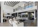 Spacious living area with open floor plan to kitchen and outdoor space at 9 Boulderback Dr, Henderson, NV 89012