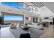 Open living room with a view of the city, featuring modern decor and a fireplace at 9 Boulderback Dr, Henderson, NV 89012