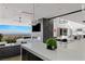 Expansive living room boasts city views, a modern fireplace, and an open floor plan at 9 Boulderback Dr, Henderson, NV 89012
