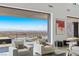 Living room with city views, modern furniture, and open access to an outdoor space at 9 Boulderback Dr, Henderson, NV 89012